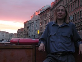 Bryan in a boat at sunset